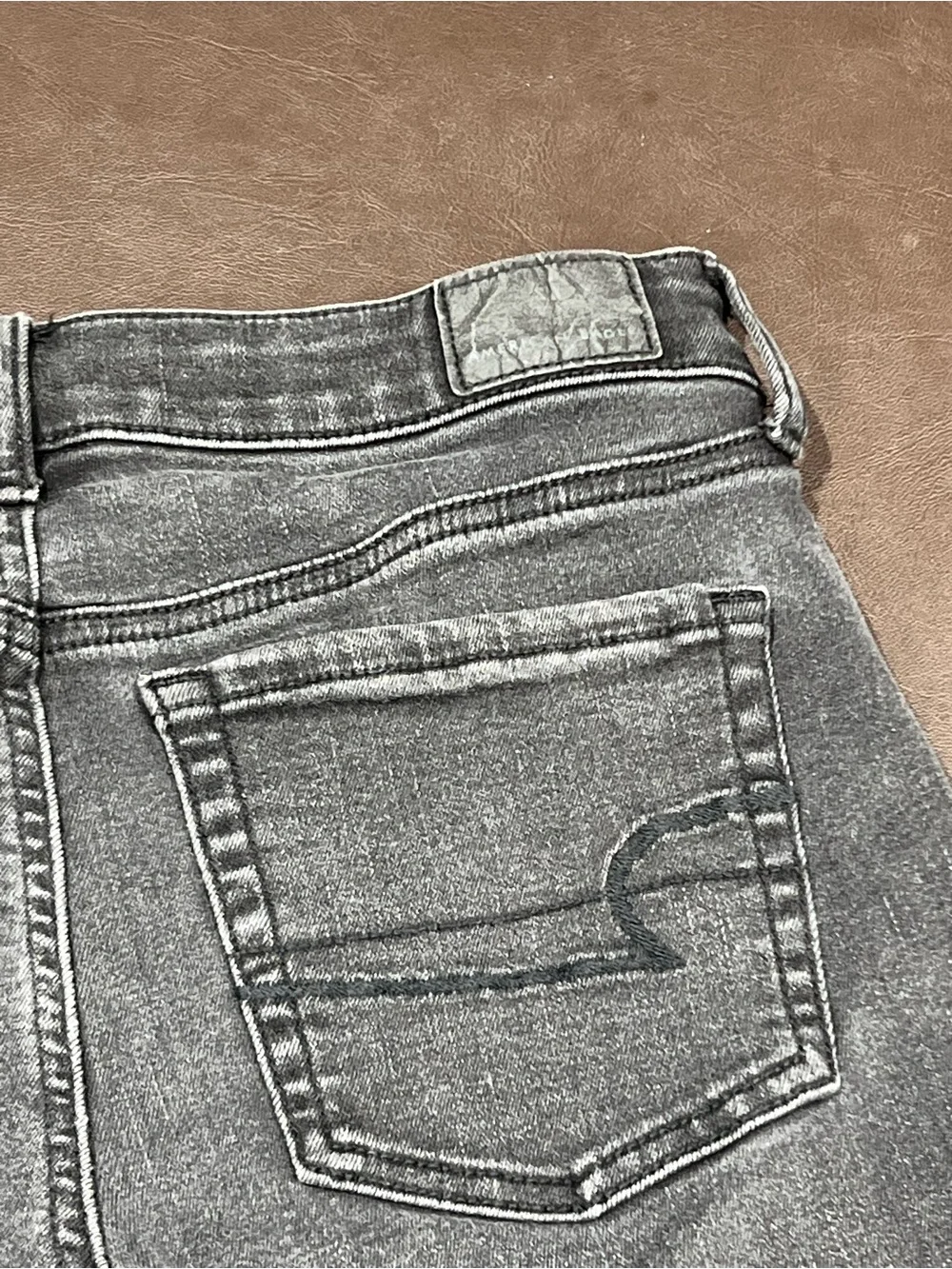 American Eagle Outfitters black denim shorts with button detail